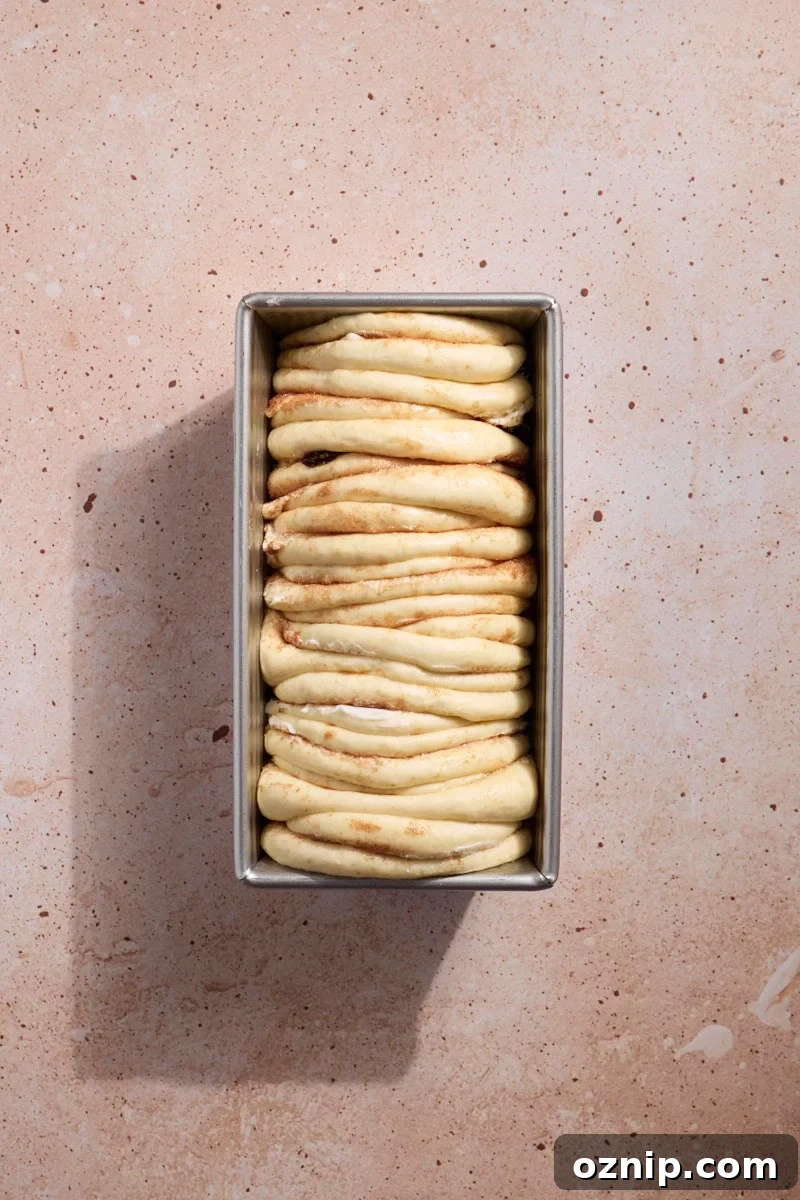 Pull apart bread in the baking pan before baking.
