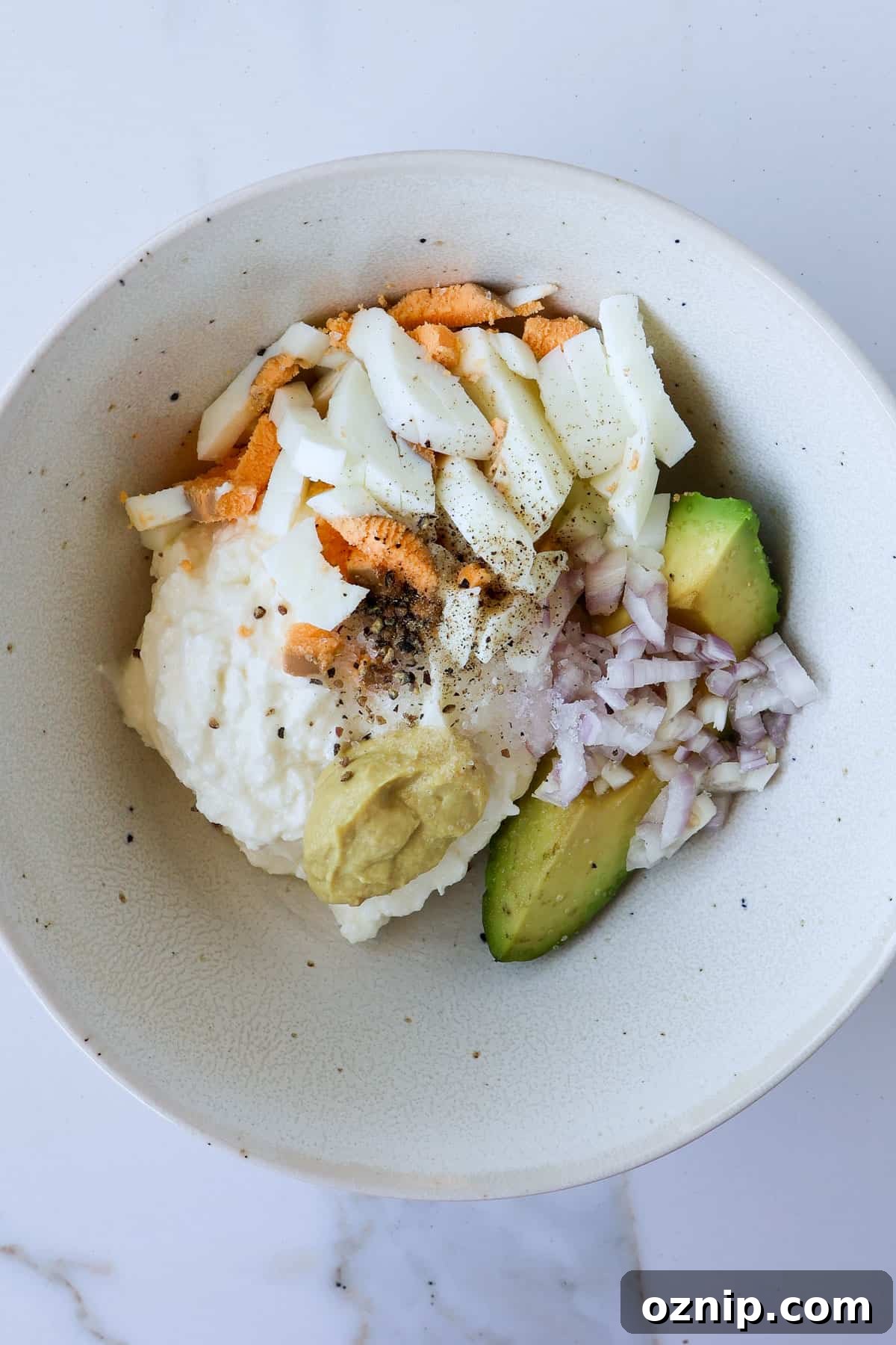 Cottage Cheese and Avocado Toast Recipe for Brunch 5 Ingredients in a bowl.