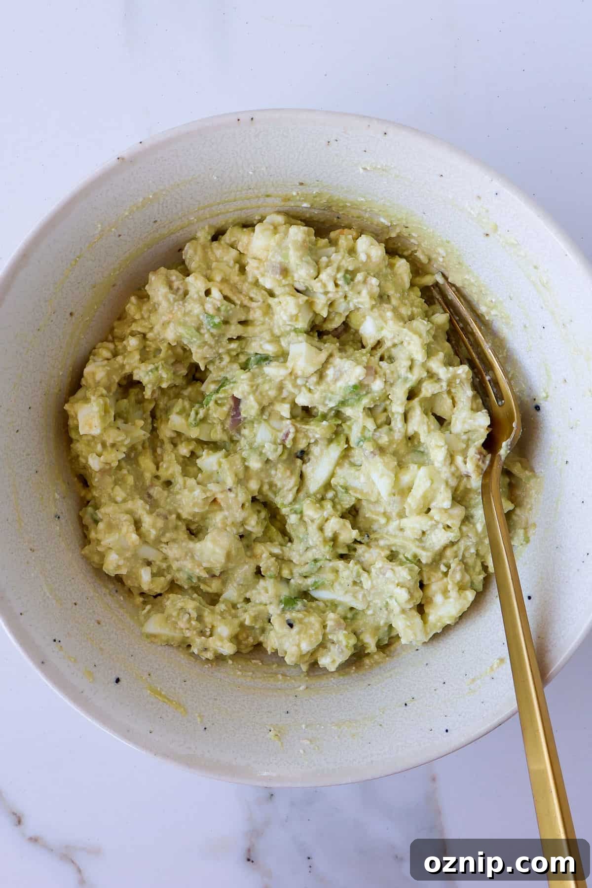 Cottage Cheese and Avocado Toast Recipe for Brunch 6 Cottage cheese avocado mash in a bowl.