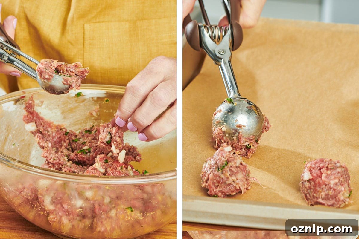 Woman scooping meatball mixture with ice cream scoop.