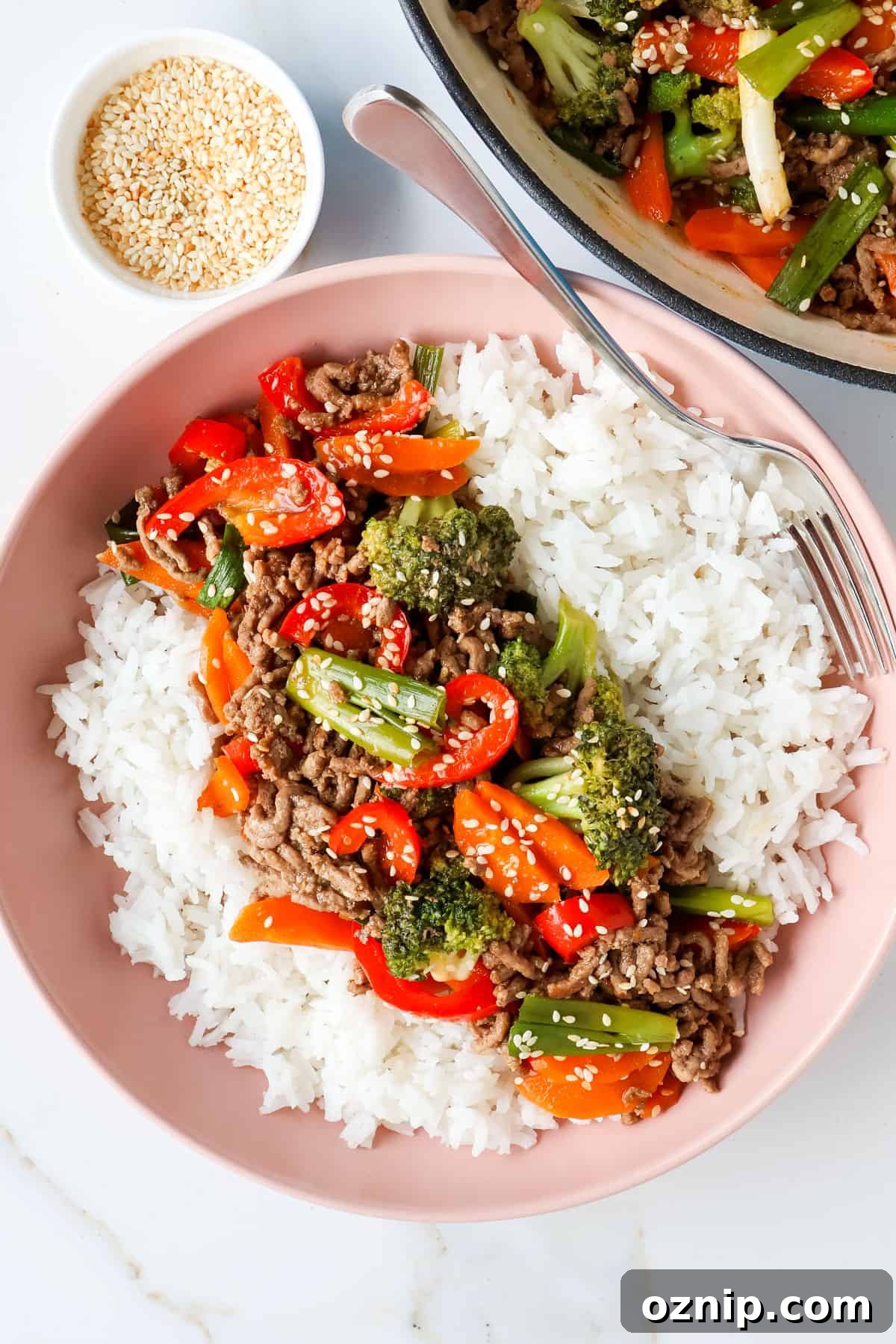 Teriyaki Beef Bowls with Rice and Vegetables 2 Teriyaki beef bowl with a fork.