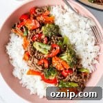 Teriyaki beef bowl with a fork.