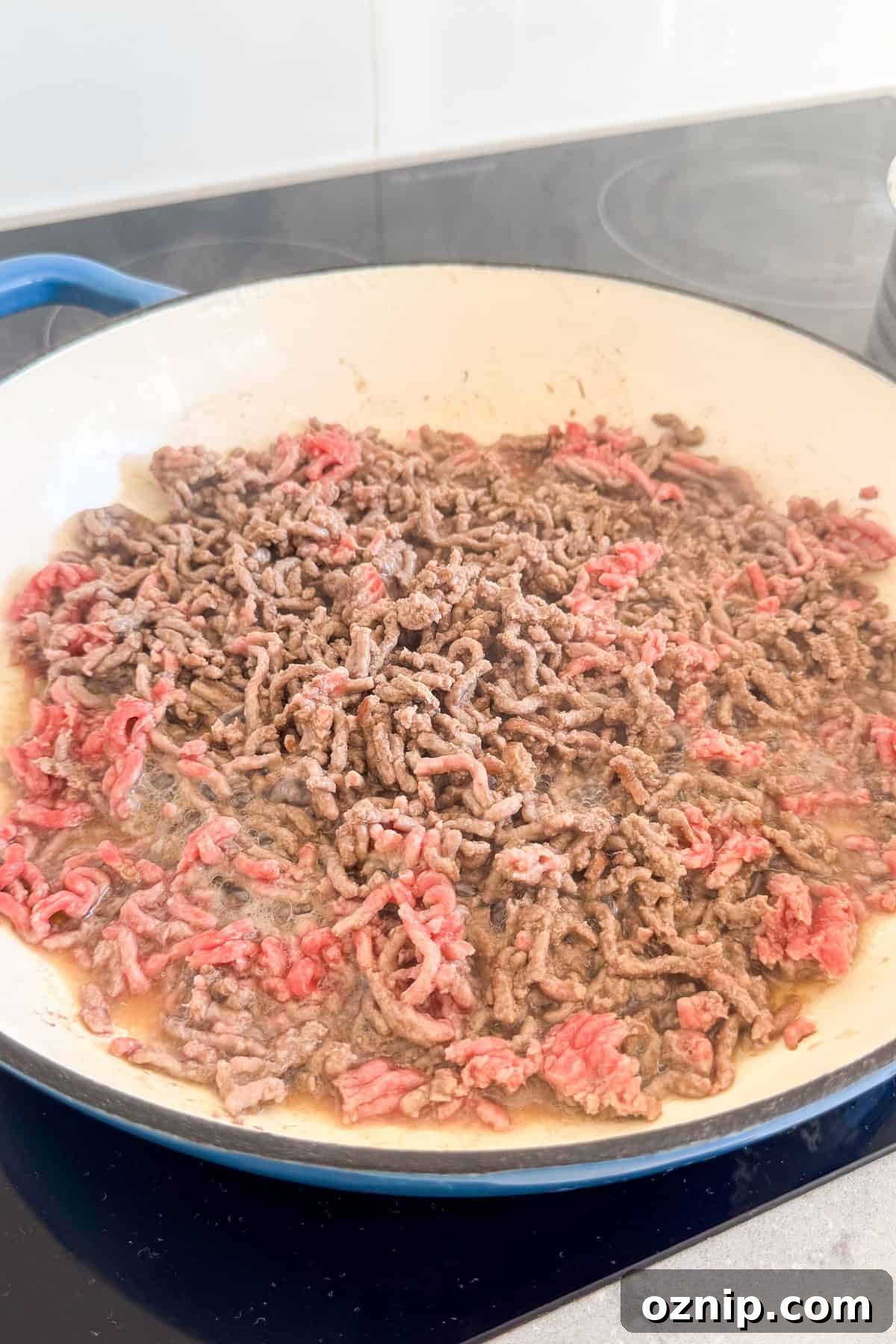 Teriyaki Beef Bowls with Rice and Vegetables 6 Ground beef being cooked in a pan.