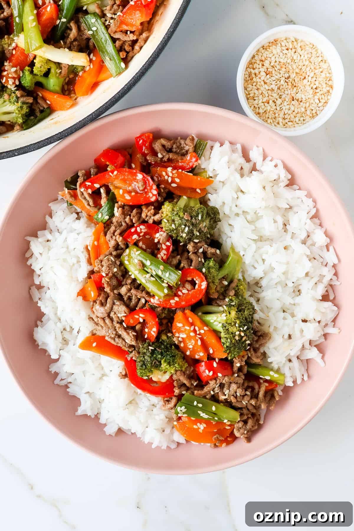 Teriyaki Beef Bowls with Rice and Vegetables 10 Teriyaki beef bowl with sesame seeds.