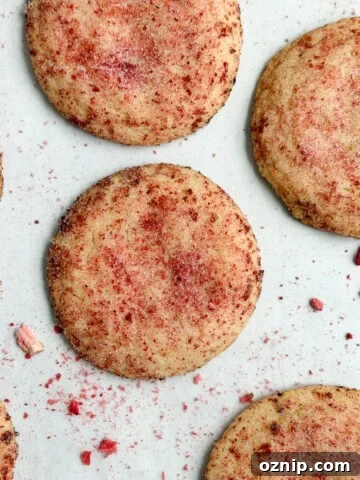 strawberry doodle cookies on a cookie sheet.