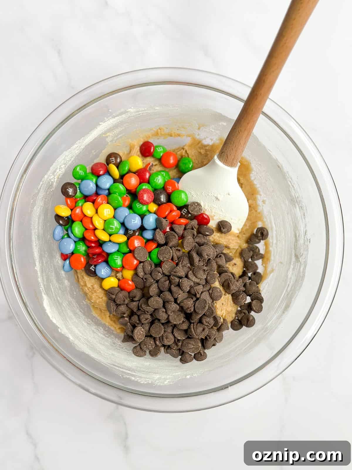 Browned Butter M&M Blondies 7 adding in the m&m's and chocolate chips.