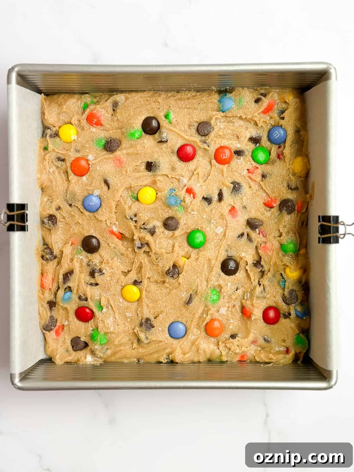 Browned Butter M&M Blondies 8 blondies in the pan before baking.