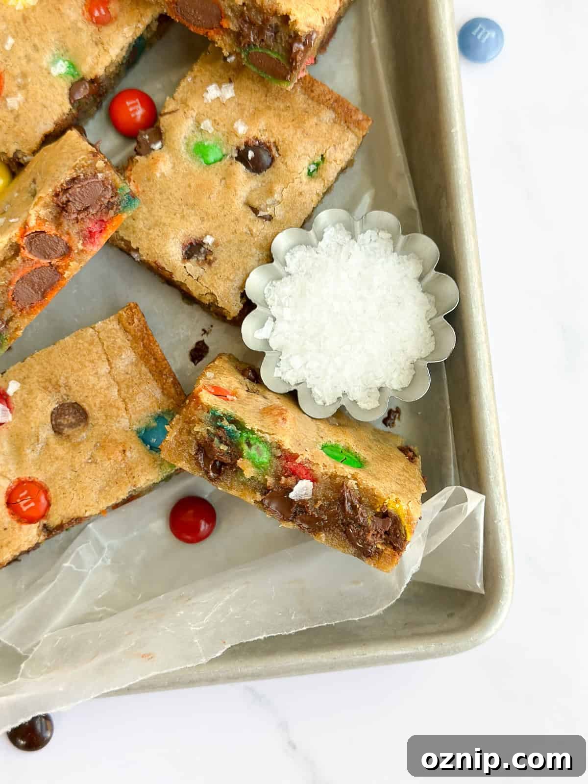 Browned Butter M&M Blondies 10 a browned butter m&m blondie turned up to see the inside texture.