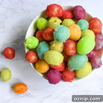 colorful frozen sour patch grapes in a ramekin.