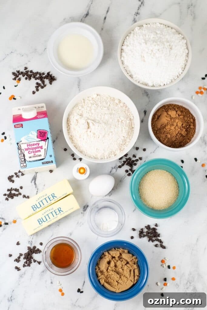 all ingredients for chocolate cookie bars on marble counter 