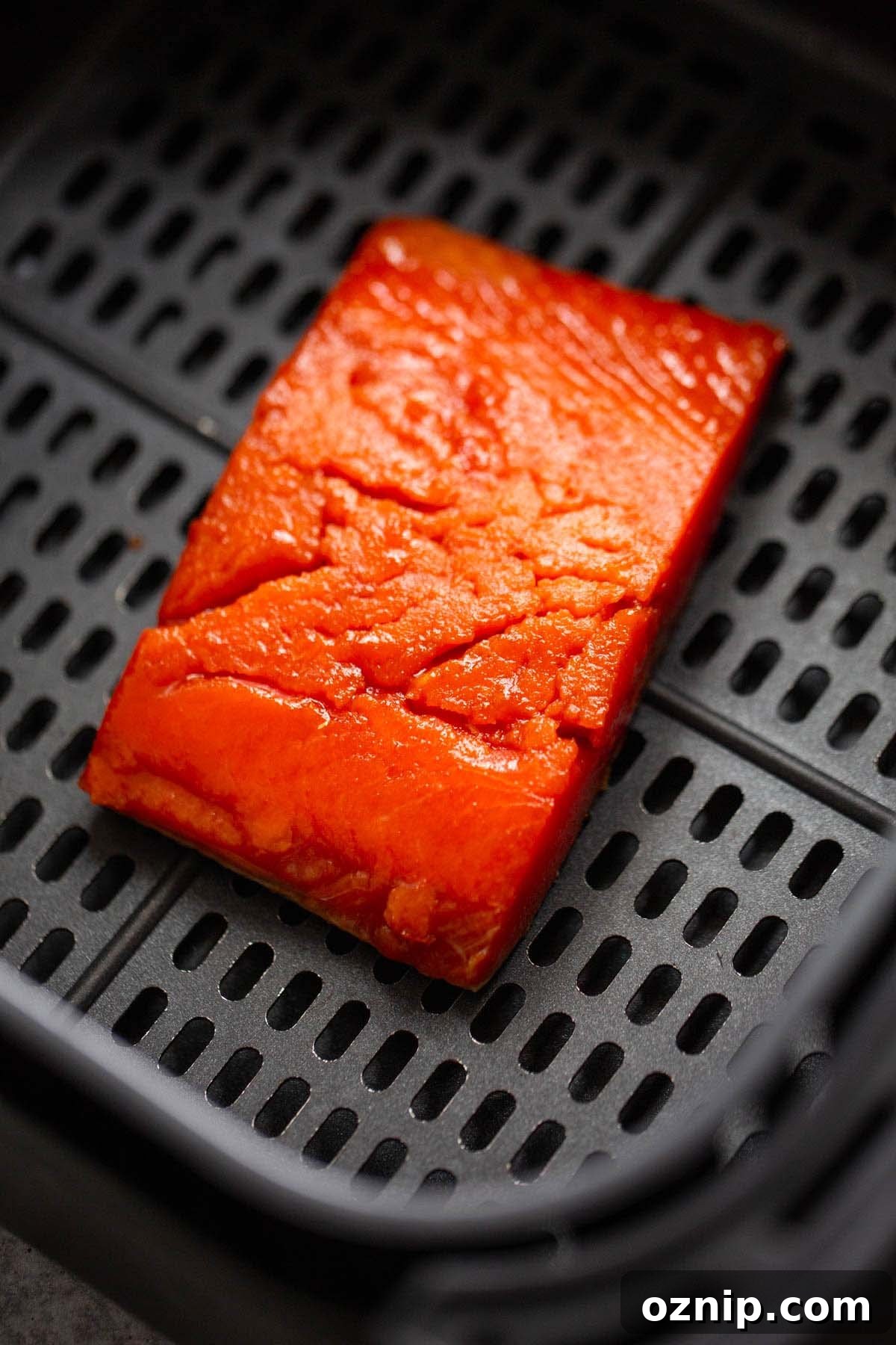 Uncooked salmon in the air fryer.