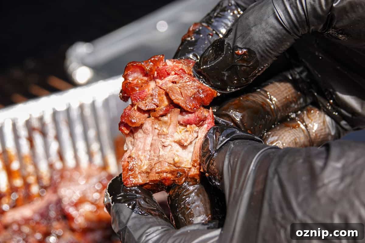 Ultra Tender Burnt Ends from Chuck Roast 9 smoked burnt ends ripped apart by hand to show how tender it is