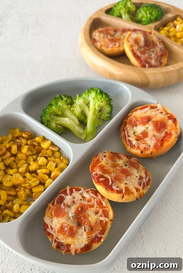 Homemade bagel bites served with corn and broccoli.