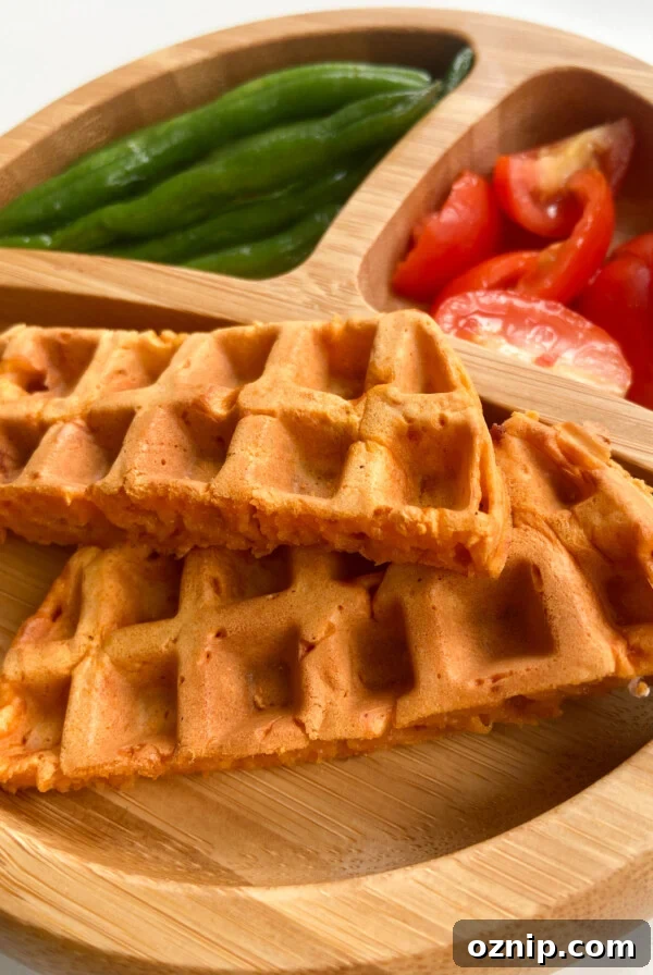 Pizza waffles served with green beans and quartered tomatoes