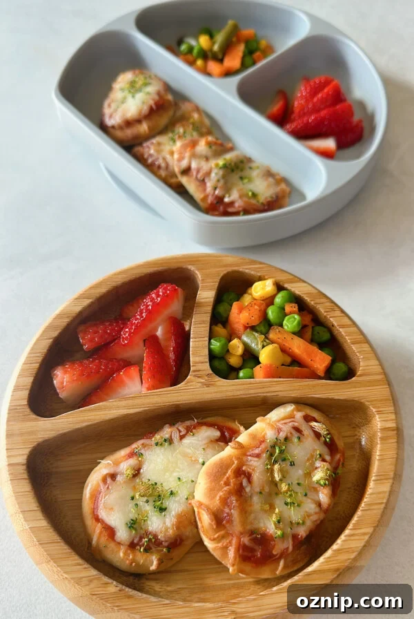 Air fryer naan pizzas served with strawberries and mixed vegetables.