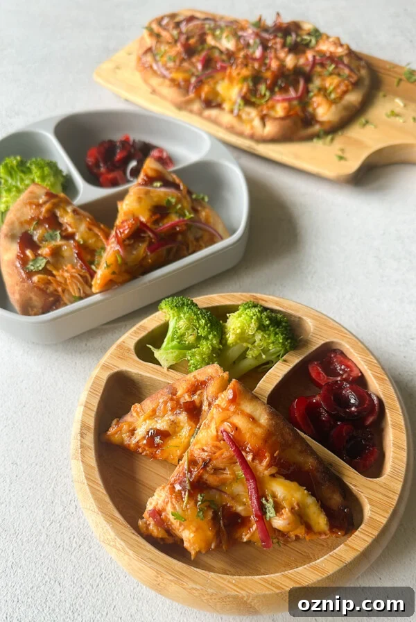 BBQ chicken naan pizzas served with broccoli and cherries.