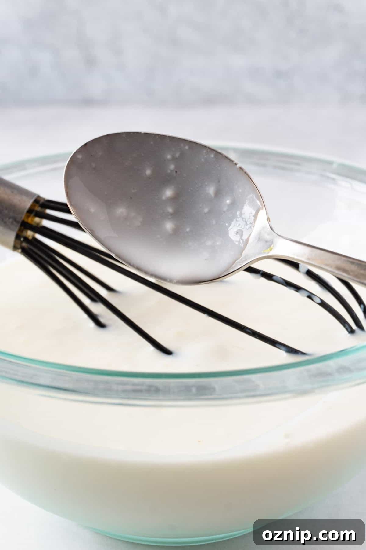 Is Your Buttermilk Spoiled? How to Spot the Signs 3 good buttermilk on spoon showing a few little lumps indicating good buttermilk.