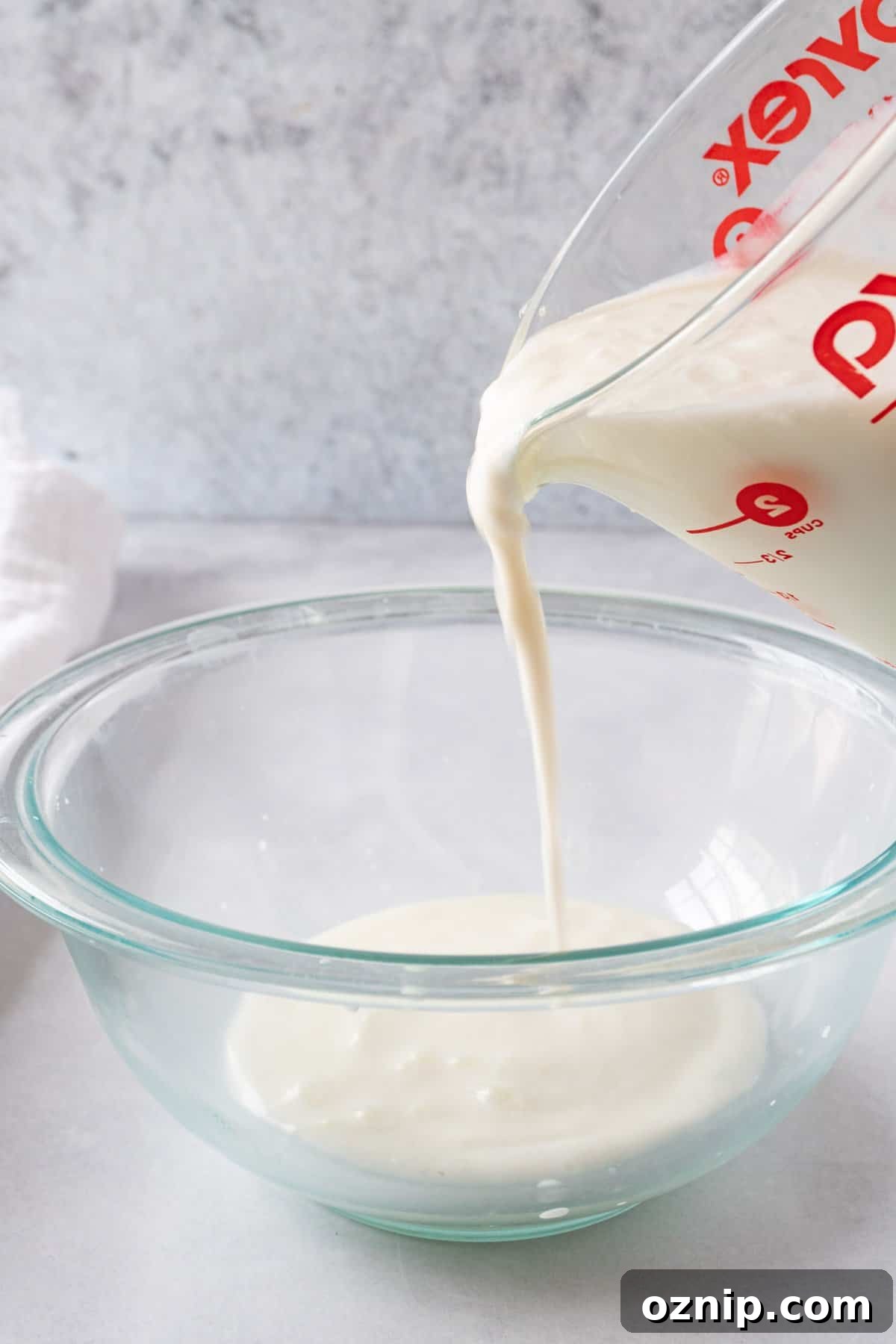 Is Your Buttermilk Spoiled? How to Spot the Signs 4 pouring good buttermilk into a glass bowl.