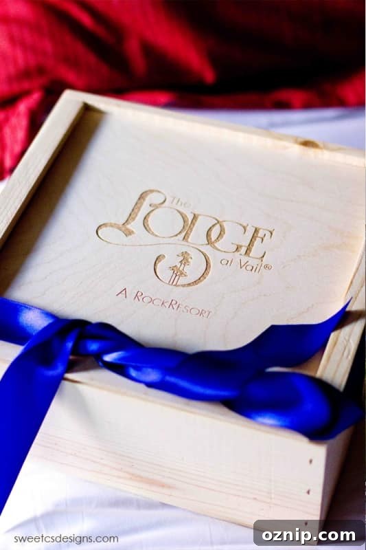 a wooden box with the lodge at vail a rock resort written on it