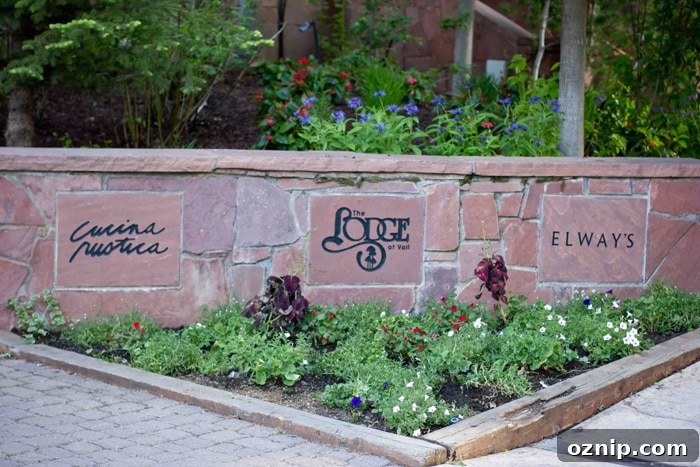 a stone wall with the lodge written on it