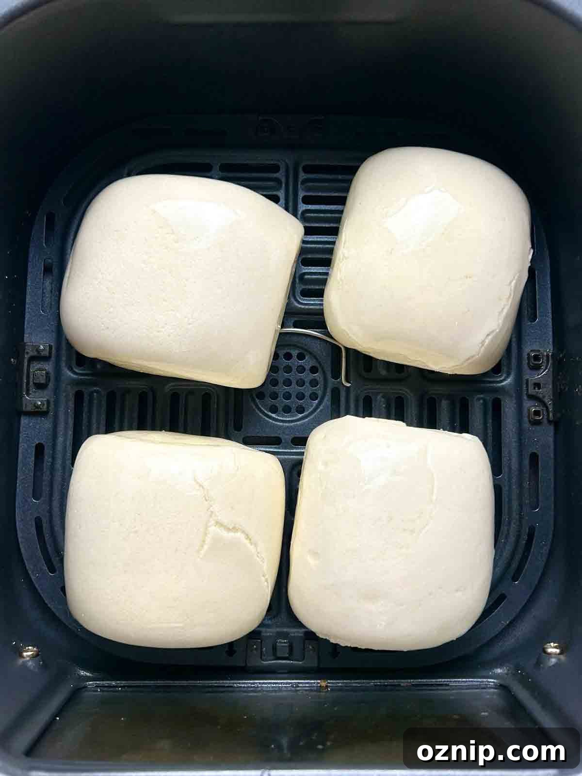 mantou buns brushed with oil in air fryer basket