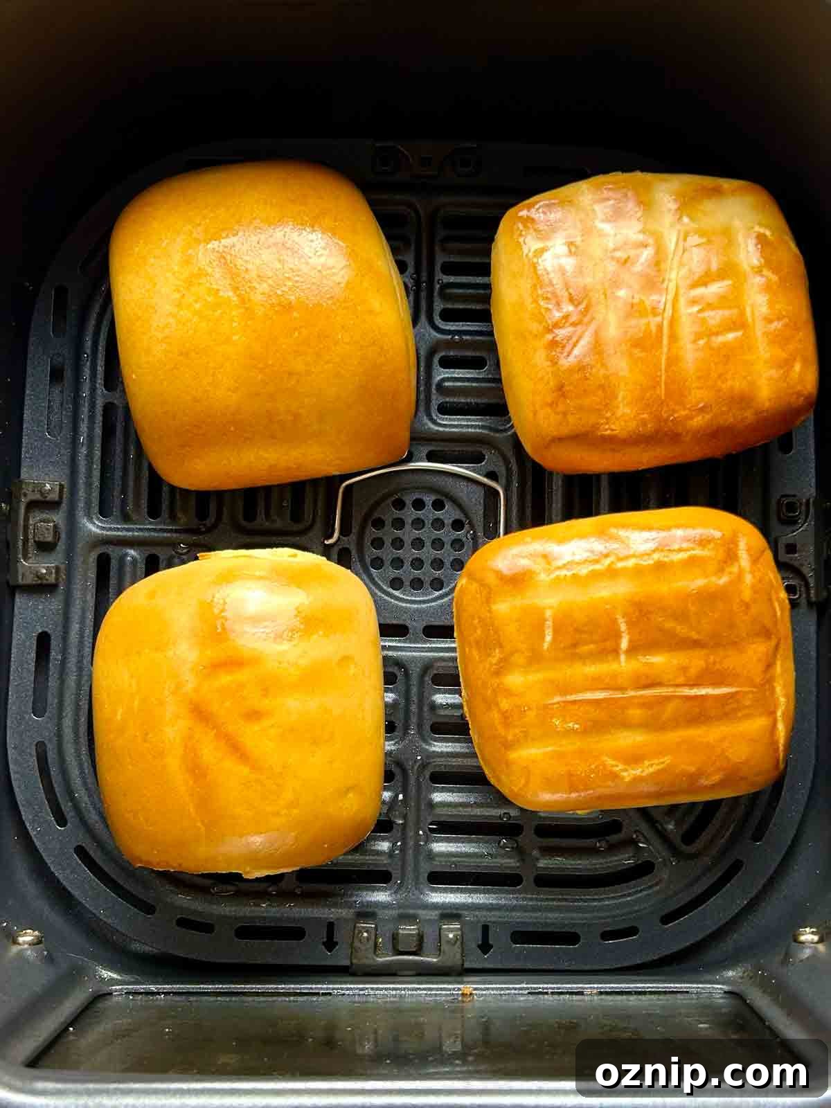 golden brown mantou in air fryer basket after frying