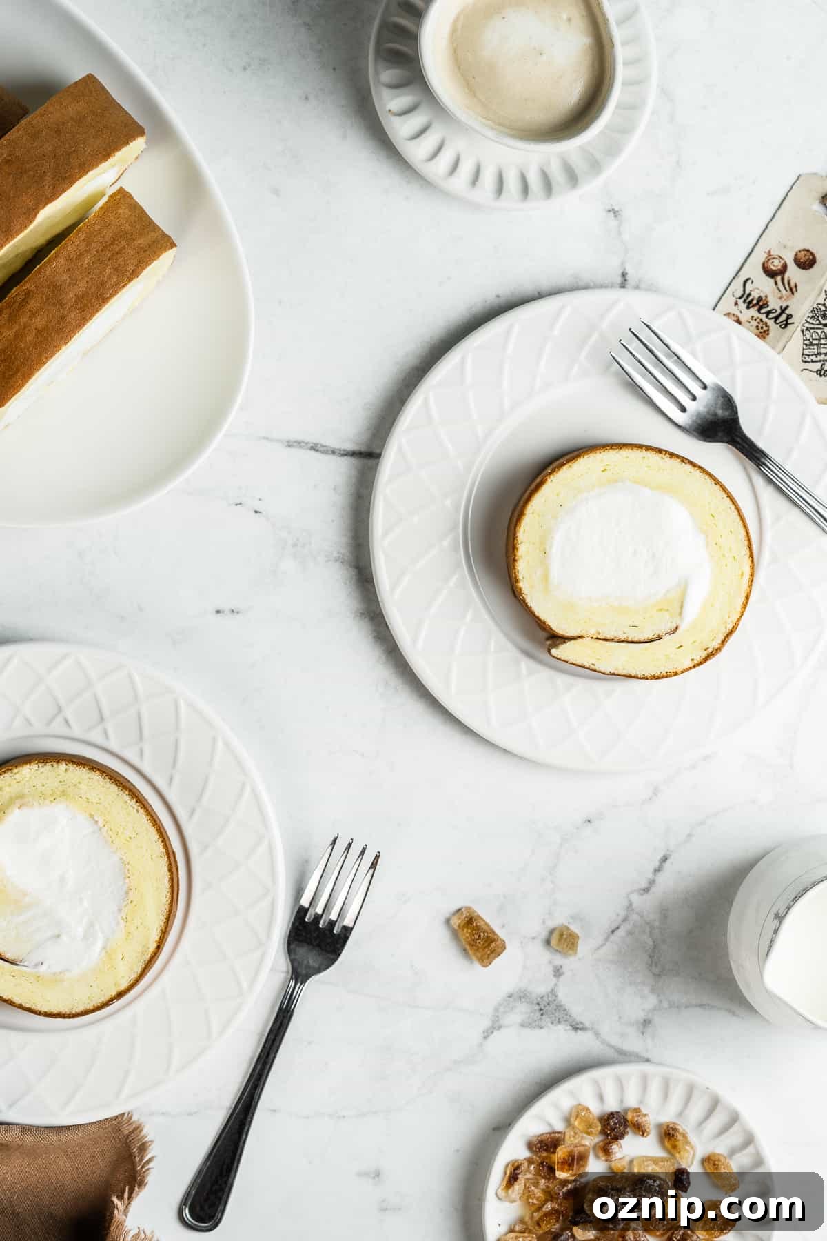 Dojima Roll: Japanese Sponge Cake Roll Recipe 5 Slices of Japanese Swiss roll on white dessert plates
