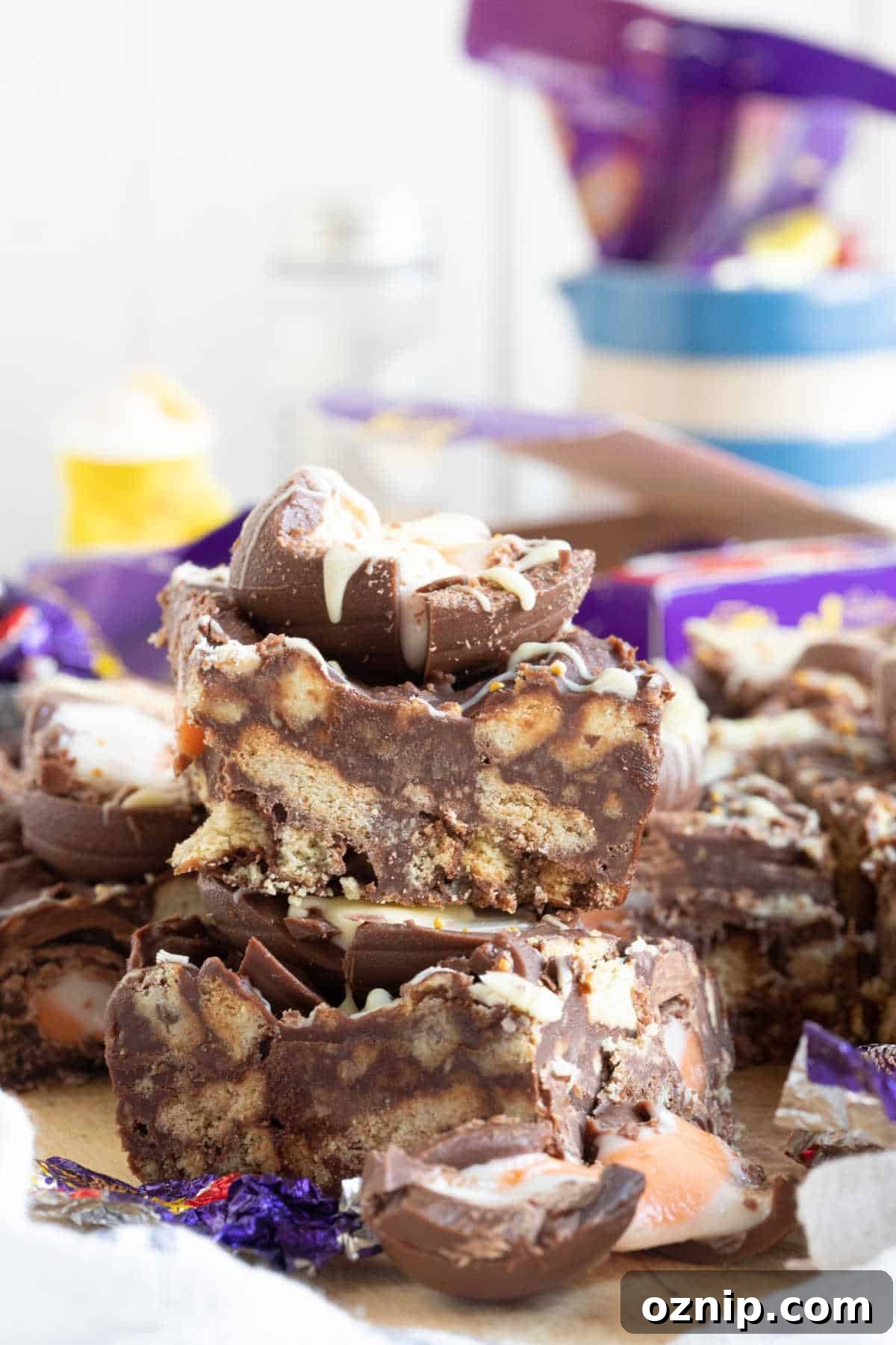 No-Bake Cadbury Creme Egg Tiffin Recipe 2 Creme egg tiffin bars stacked on top of each other.