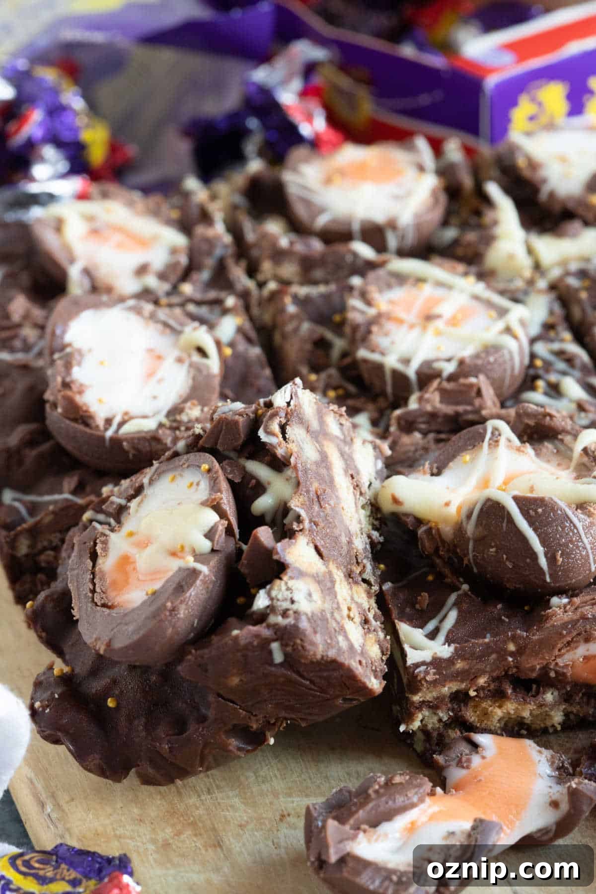 No-Bake Cadbury Creme Egg Tiffin Recipe 7 Creme egg tiffin on a cutting board.