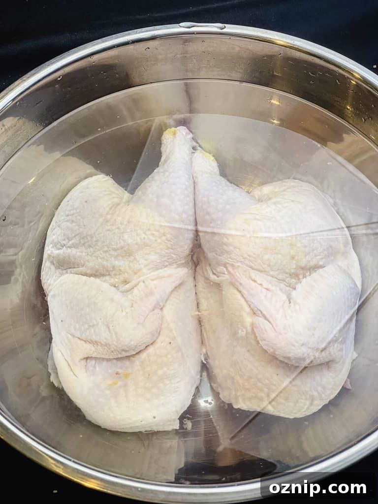 How to Grill Half Chicken for Juicy, Crispy Skin 7 chicken halves submerged in a salt water brine