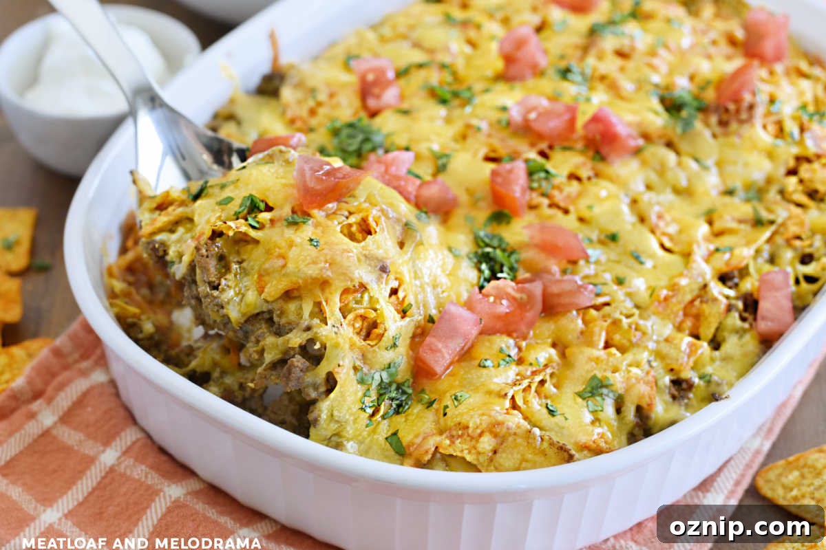 Cheesy Doritos and Ground Beef Casserole 10 easy doritos casserole with ground beef and cheese on a spoon