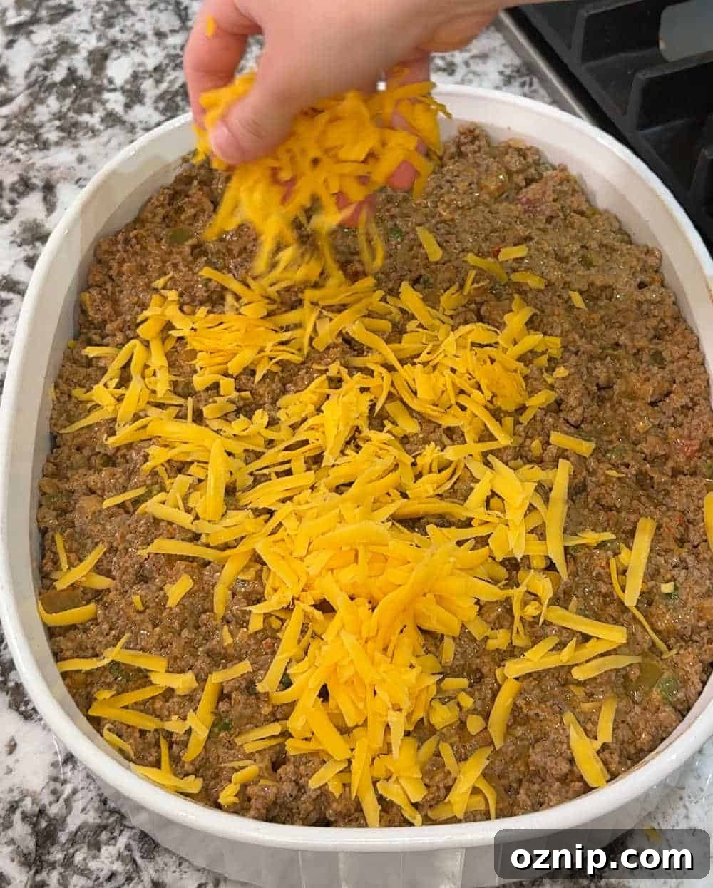 Cheesy Doritos and Ground Beef Casserole 7 sprinkle cheese over beef.