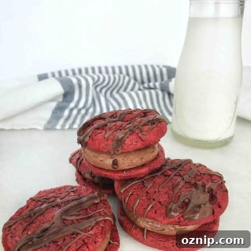 4 red velvet cookie sandwiches with bottle of milk