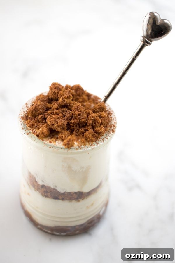 Biscoff Tiramisu Recipe with Speculoos Cookie Butter 4 biscoff tiramisu in a jar with a heart shaped spoon