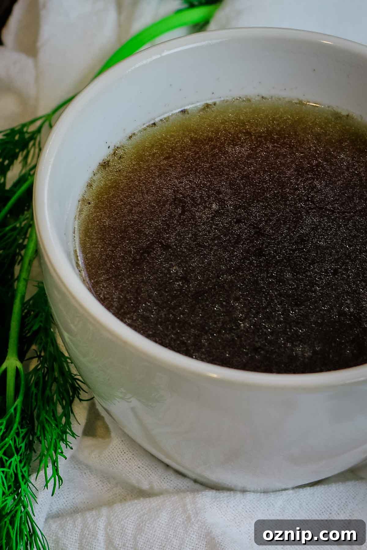 bone broth in white mug