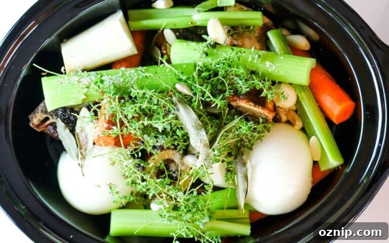 veggies on top of bones in slow cooker.