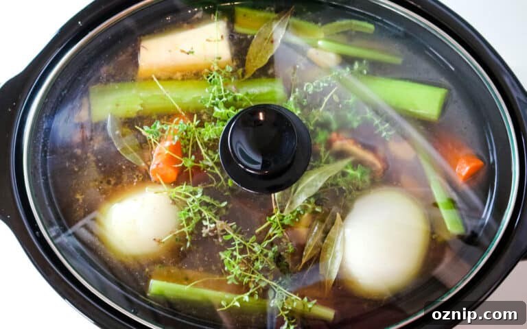 closed slow cooker with bones and veggies.