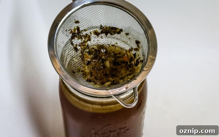 running broth through a sieve.