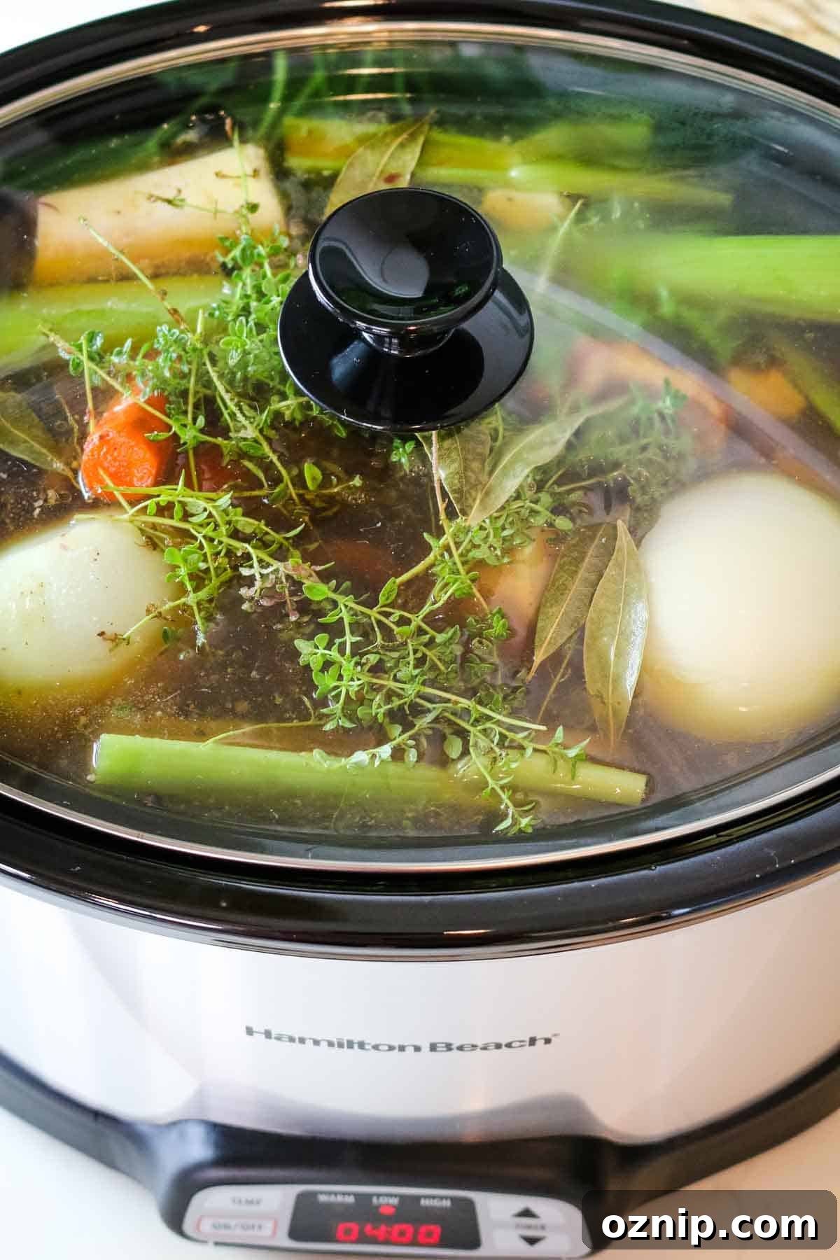 closed slow cooker with vegetables.