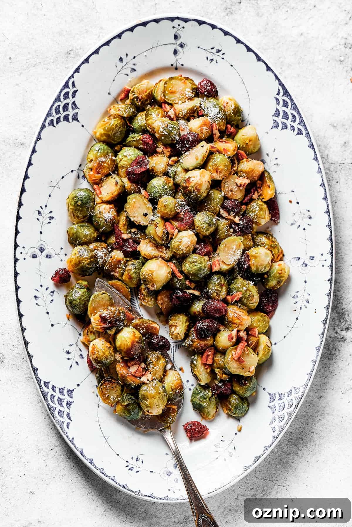 Oval platter with roasted, glazed brussel sprouts.