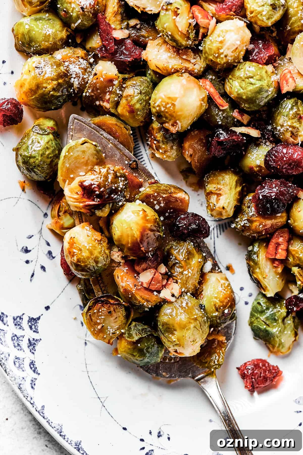 A serving platter loaded with roasted brussels sprouts.