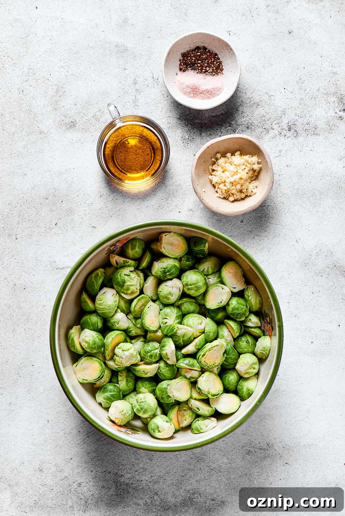 From top: Salt and pepper, olive oil, garlic, brussels sprouts.
