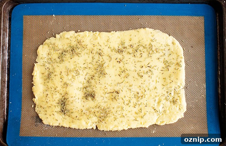 keto gluten-free rosemary flatbread overhead view unbaked