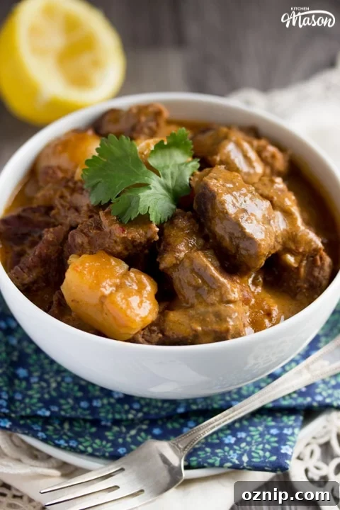 beef massaman curry in a white bowl