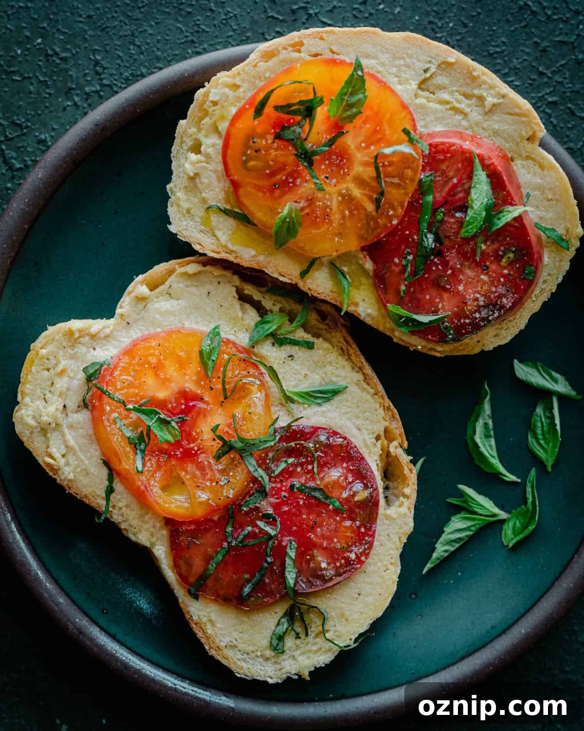 fermented cashew cheese on toast with heirloom tomatoes and basil