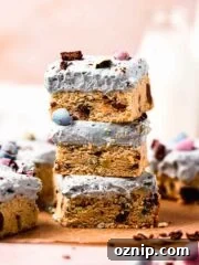 stack of mini egg cookie bars with cream cheese frosting