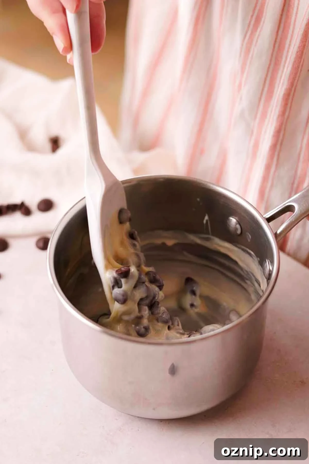 stirring chocolate fudge ingredients together in saucepan