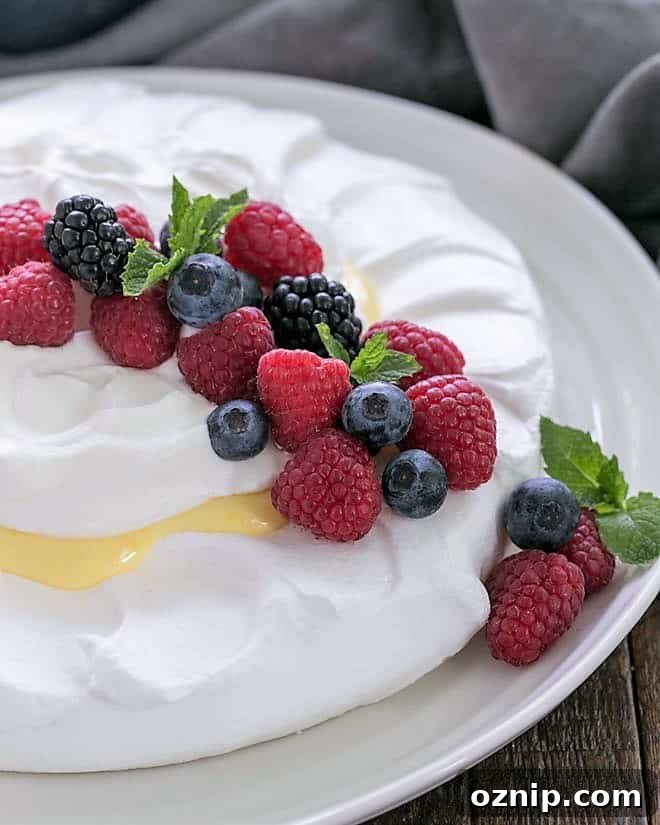 Lemon on a cloud topped with berries on a white serving plate