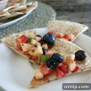 Low Sugar Apple Berry Salsa with Cinnamon Chips 12 Apple Berry Salsa on 3 cinnamon chips on a plate.