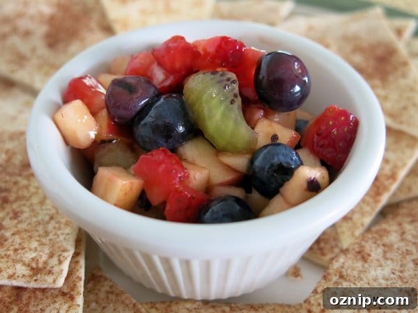 Low Sugar Apple Berry Salsa with Cinnamon Chips 8 Fruit Salsa in single serve bowl with Cinnamon Chips around it